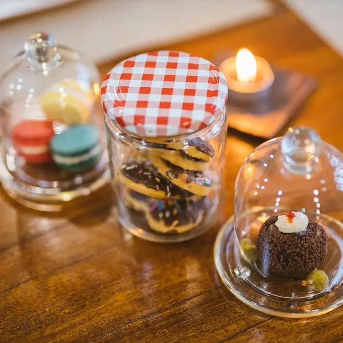 Sweet jars resting on a wooden table