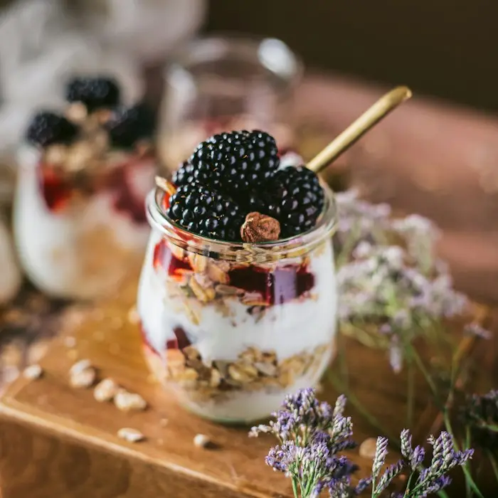 Creamy jars topped with fresh blackberries